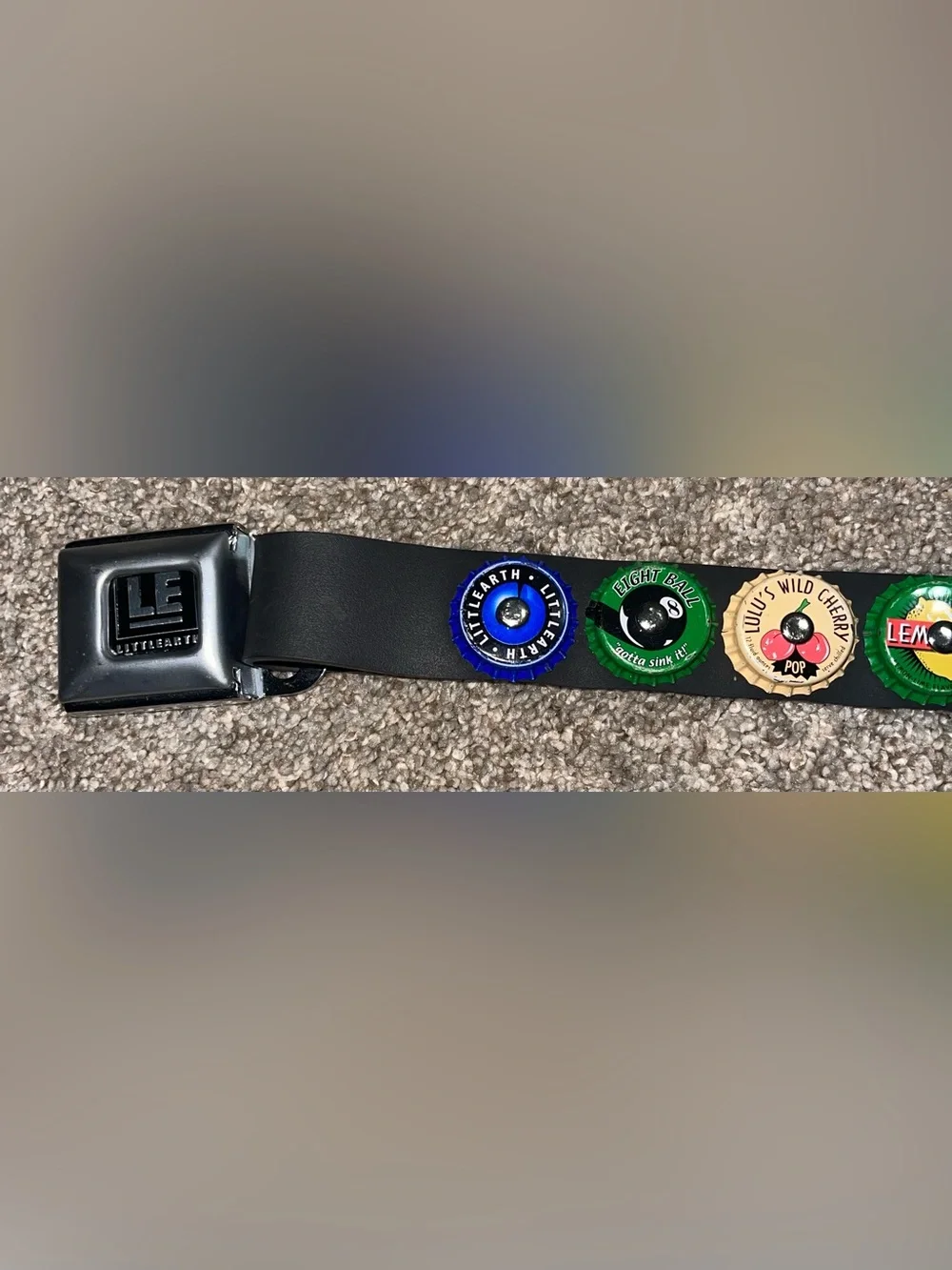 Little Earth seatbelt belt bottle caps
